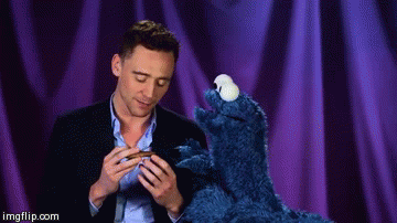 Tom  Hiddleston with the cookie monster